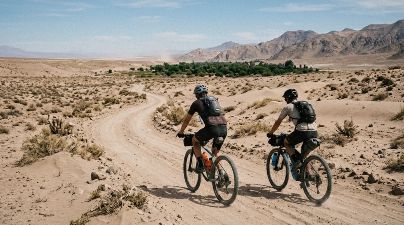 Cyclists riding through open desert terrain on a 4-hour Atacama Desert bike tour near San Pedro de Atacama, Chile