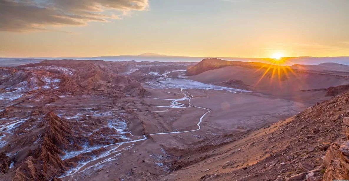 Travelers walking the amphitheater rim on a Valle de la Luna tour in the Atacama Desert, San Pedro de Atacama, Chile
